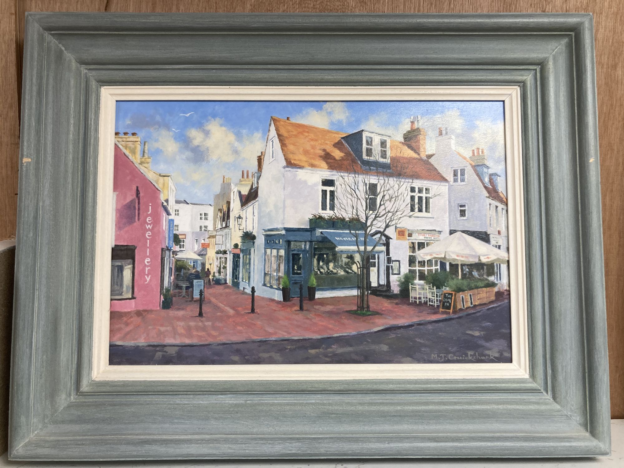 Michael J. Cruikshank, oil on board, Jewellery shops in The Lanes, Brighton, signed, 26 x 39cm